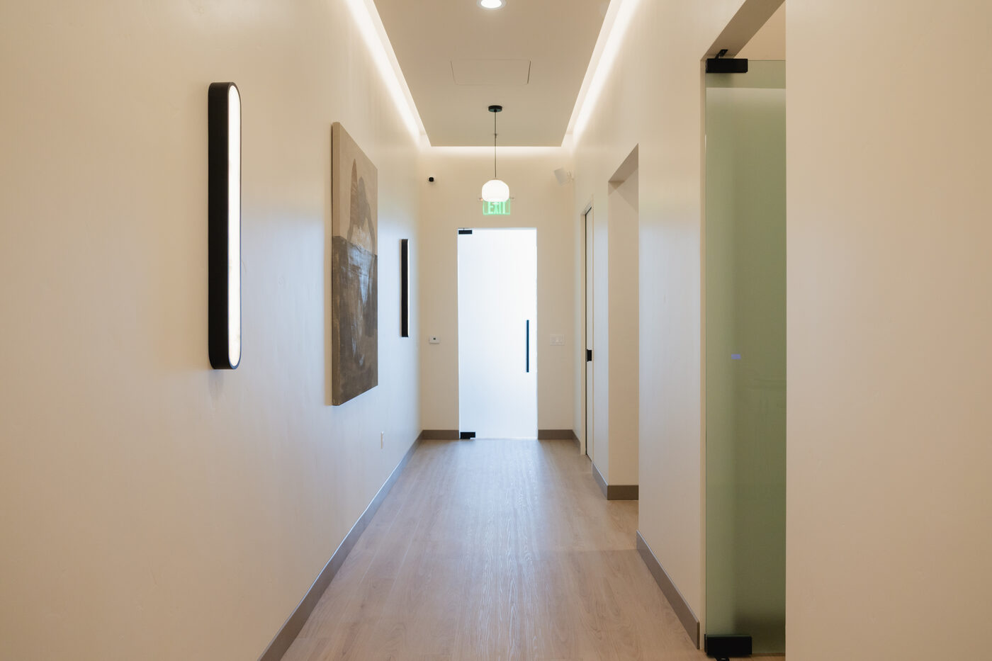 The corridor, lit to feel like a spa rather than a clinic